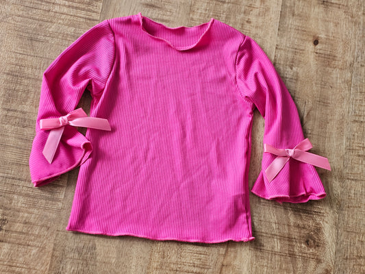 Roze trui met strikjes
